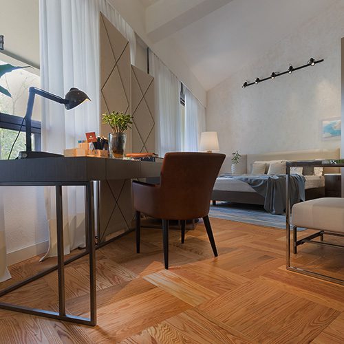 Ambiente interno com piso de taco de madeira, mesa de trabalho elegante e decoração moderna, criando um ambiente acolhedor e sofisticado.